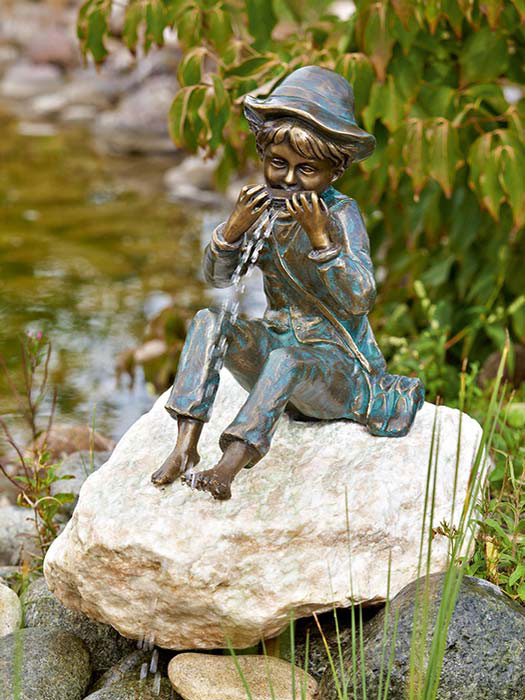 bronzefigur-til Bronzefigur Til auf Rosario Findling (Art.Nr. 88588.1)